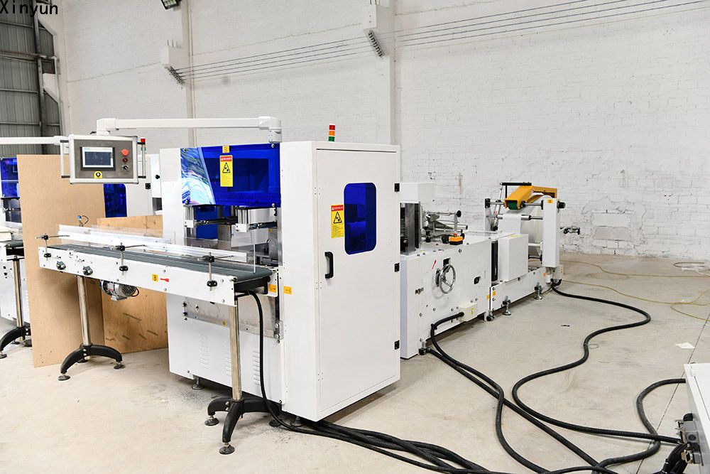 Automatic transferring napkin tissue paper making machine