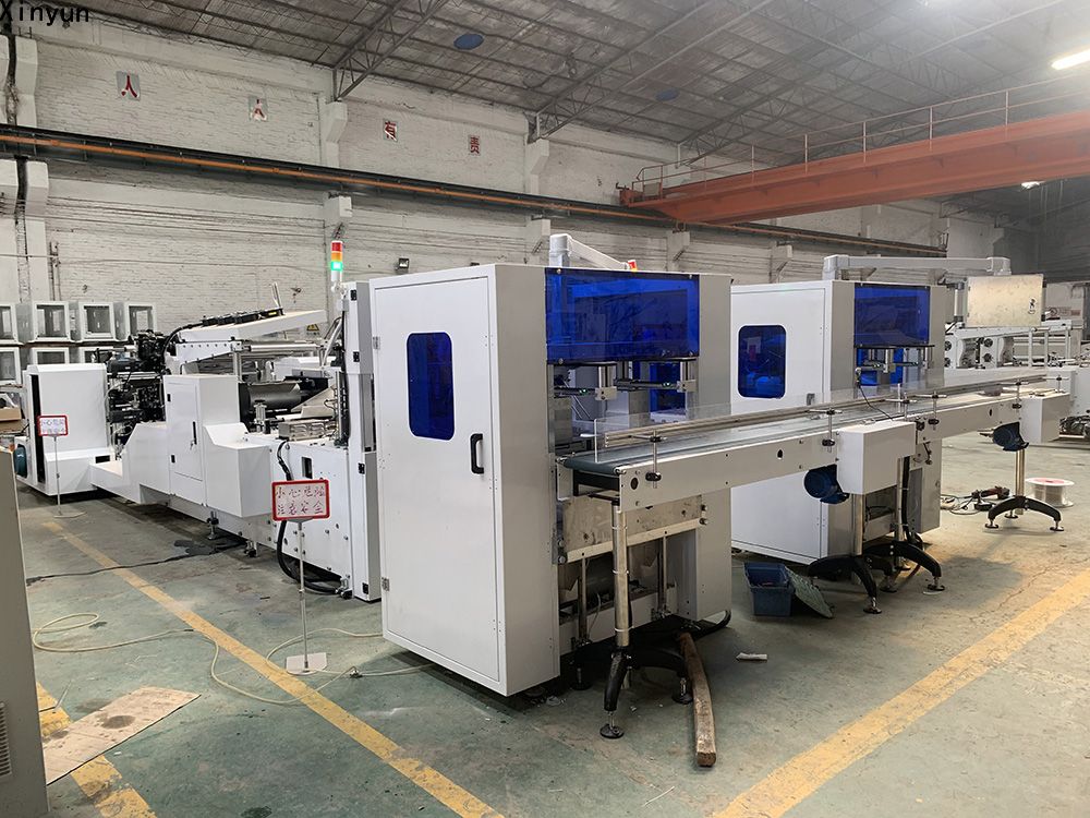Automatic transferring napkin tissue paper making machine